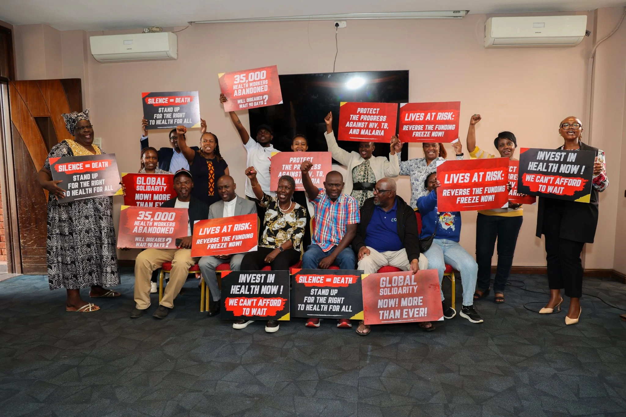 Members of Nephak holding placards Kenya representing HIV community